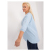 A light blue plus-size blouse with slits