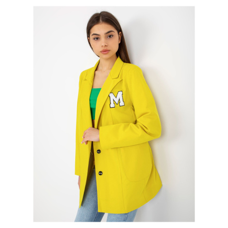 Lady's yellow jacket with patches