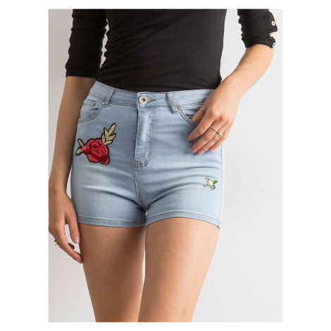 Blue high-waisted shorts with patches