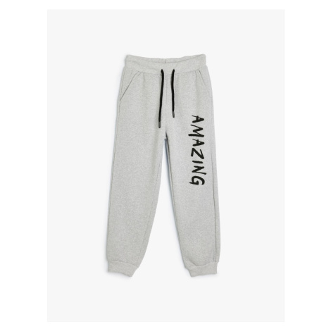 Koton Jogger Sweatpants with Tied Waist and Sports Print Detail