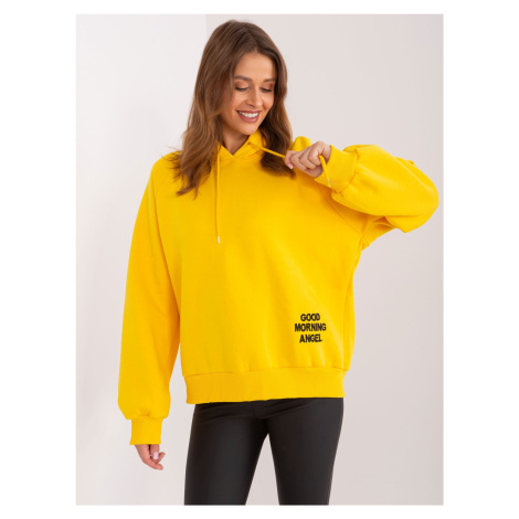 Yellow insulated oversize sweatshirt with a hood and inscription