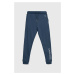 Detské bavlnené tepláky Calvin Klein Jeans tmavomodrá farba, s potlačou