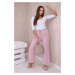 Wide trousers with a powder pink tie