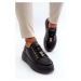 Women's leather sneakers on a black Vinceza platform