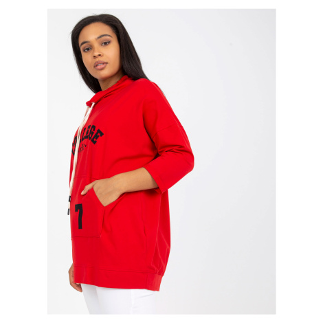 A red blouse in larger size with 3/4 sleeves