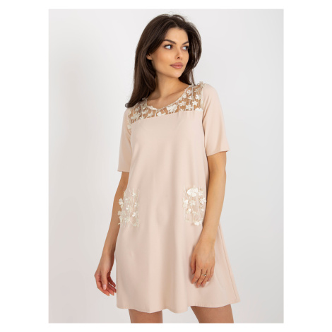 Beige cocktail dress with floral application