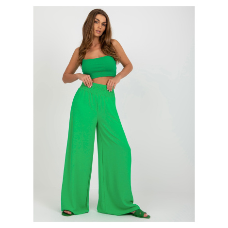 Wide green fabric trousers
