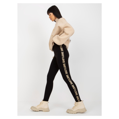 Black casual leggings with lettering on the sides
