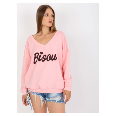 Light pink and black sweatshirt with printed design and V-neck
