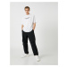 Koton Parachute Trousers with a loose fit, lacing at the waist, and elasticated legs with a pock