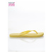 Fashionable and comfortable yellow women´s flip-flops for the beach