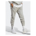 Adidas Teplákové nohavice Essentials French Terry Tapered Cuff 3-Stripes Joggers IC9407 Sivá Reg