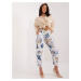 White women's fabric trousers with flowers