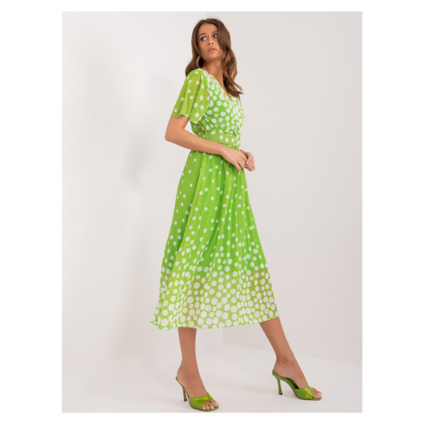 Light green women's polka dot dress with belt