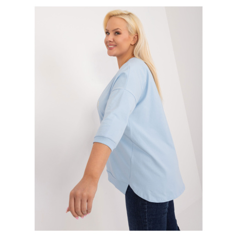 A light blue plus-size blouse with slits