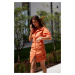 Orange shirt dress with ruffles on the hips