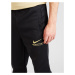 Nike Sportswear Nohavice  svetložltá / čierna