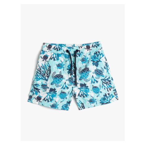 Koton Marine Shorts with a Tie Waist Turtle Printed Mesh Lined.