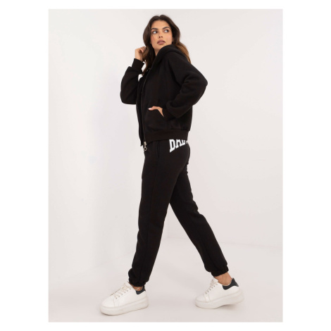 Black three-piece tracksuit