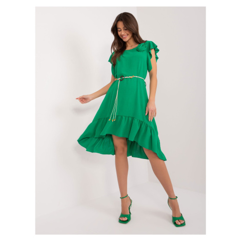 Green dress with ruffles and flower