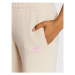 New Balance Teplákové nohavice WP21508 Béžová Regular Fit