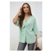 Oversized blouse with a light mint neckline