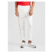 Nike Sportswear Funkčné nohavice 'AIR'  oranžová / biela