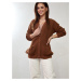 Loose women's sweater with brown buttons