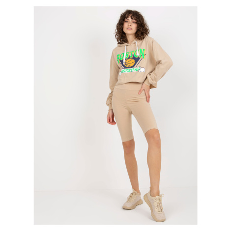 Beige casual set with a short sweatshirt and cycling shoes