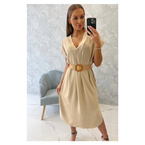 Dress with a decorative belt of beige color