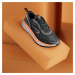 Pánska bežecká obuv Kiprun KS900 čierno-oranžová