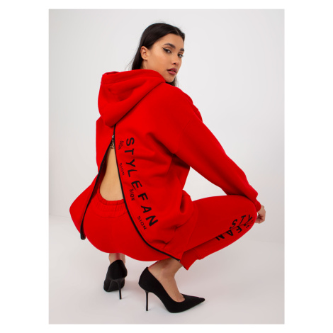 Red women's tracksuit with zippers and inscriptions