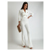 White jumpsuit with wide legs