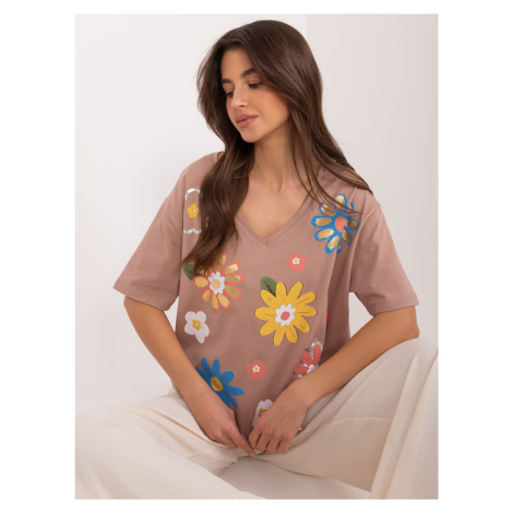 Light brown women's blouse with a printed neckline