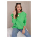 Cotton blouse with ruffles on the shoulders in light green color