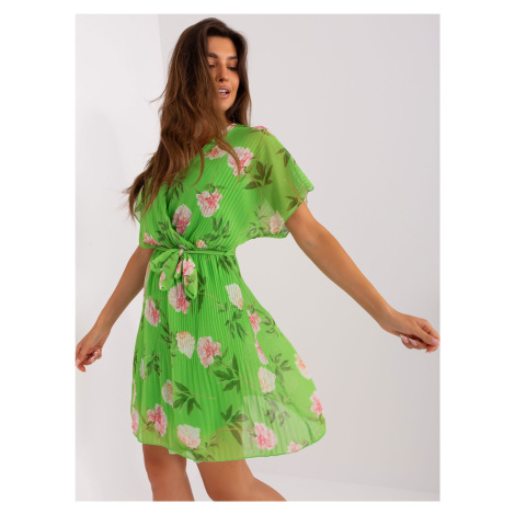 Light green flowing dress with flowers