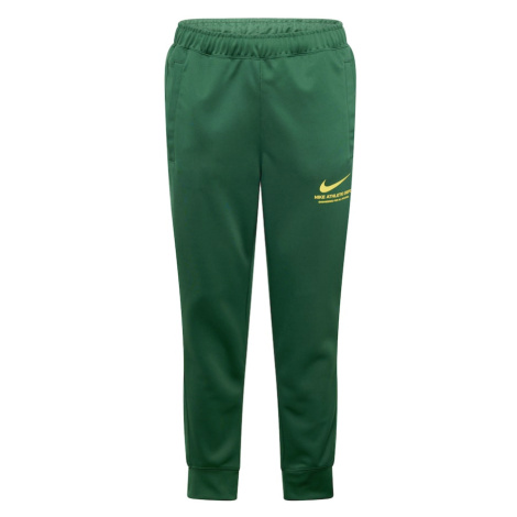 Nike Sportswear Nohavice  žltá / tmavozelená