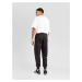 PUMA Športové nohavice 'Posterize 2.0'  čierna / biela