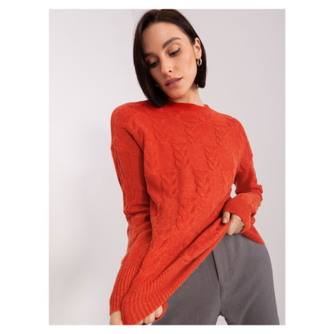 Dark orange sweater with cables and a round neckline