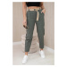 Trousers with a wide belt in light khaki colors
