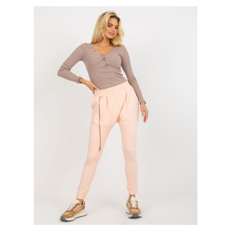 Peach baggy zippered sweatpants