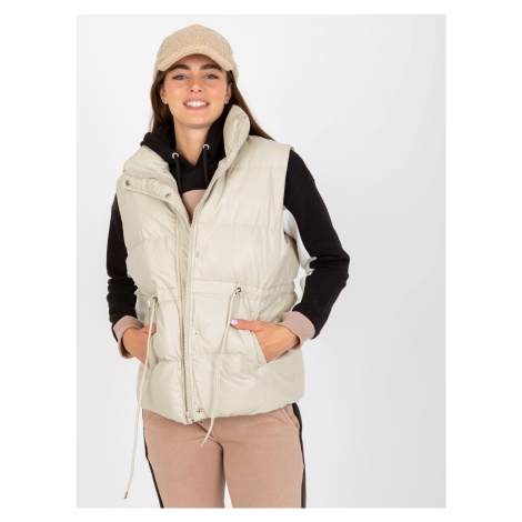Light beige down vest made of artificial leather without hood