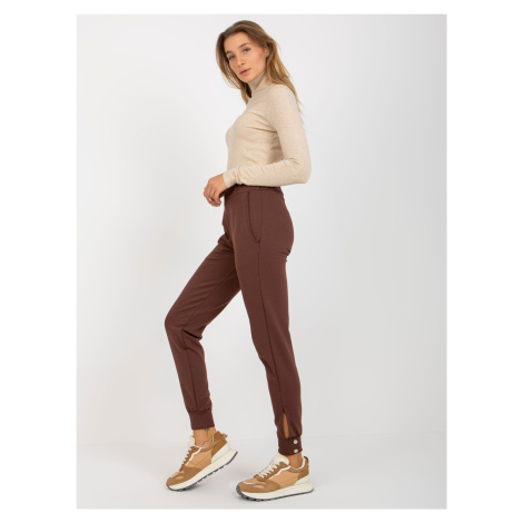 Brown trousers with leg fastening from OCH BELLA