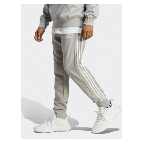 Adidas Teplákové nohavice Essentials French Terry Tapered Cuff 3-Stripes Joggers IC9407 Sivá Reg