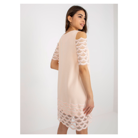 Peach cocktail dress with decorative sleeves