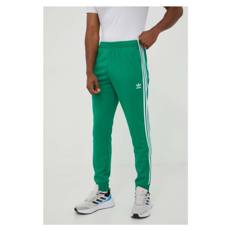 Tepláky adidas Originals Adicolor Classics SST zelená farba, s nášivkou. IK3515