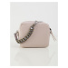 Light pink women´s handbag with a decorative handle