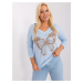 Light blue oversized women's blouse with cuff