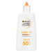 Garnier Ambre Solaire Super UV denný fluid proti tmavým škvrnám s vitamínom C a SPF 50+