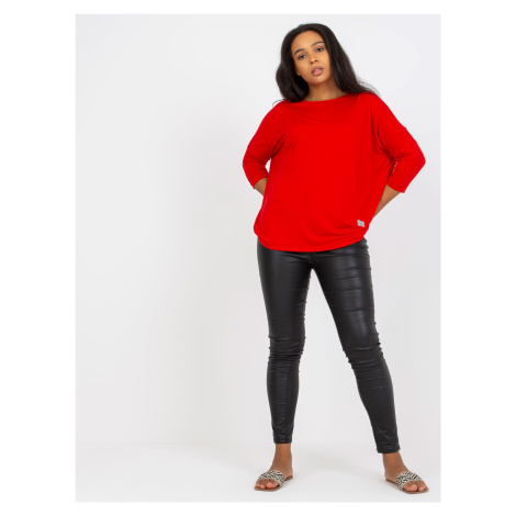 Plain red cotton blouse of larger size